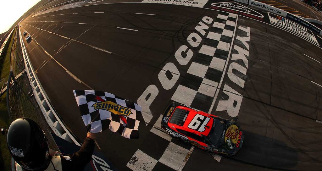 Chase Briscoe's No. 19 Toyota drives under the checkered flag to seal victory at Pocono Raceway