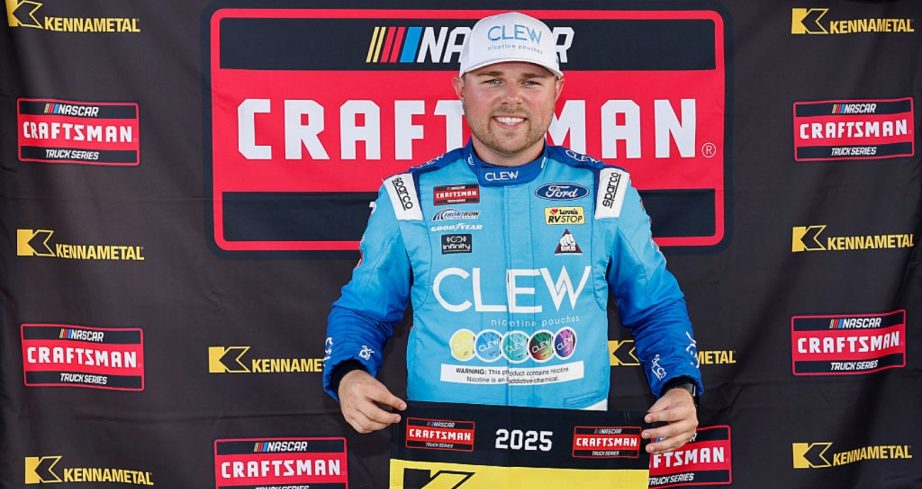 Layne Riggs celebrates after winning the pole at Darlington.