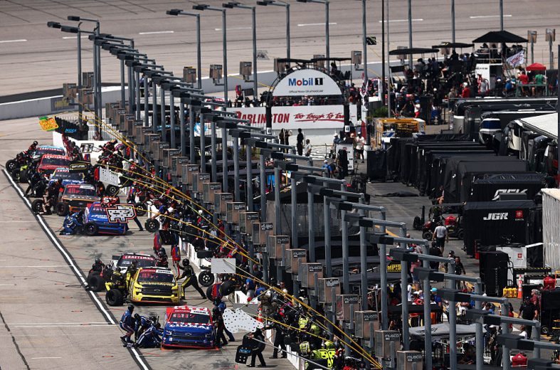 Multiple trucks pit at Darlington.