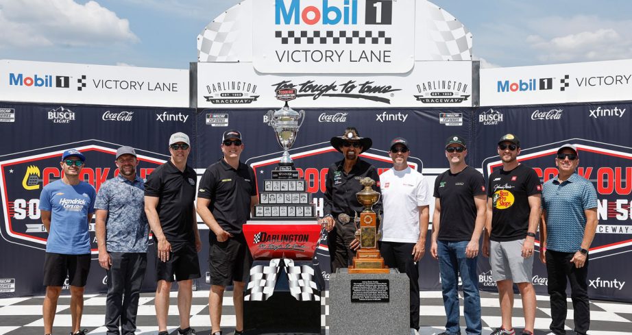 Past Southern 500 winners line up in Victory Lane to pose for a photo at Darlington Raceway.