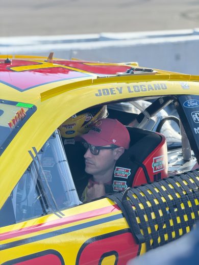 Joey Logano sits in his No. 22 Team Penske Ford at Darlington Raceway.