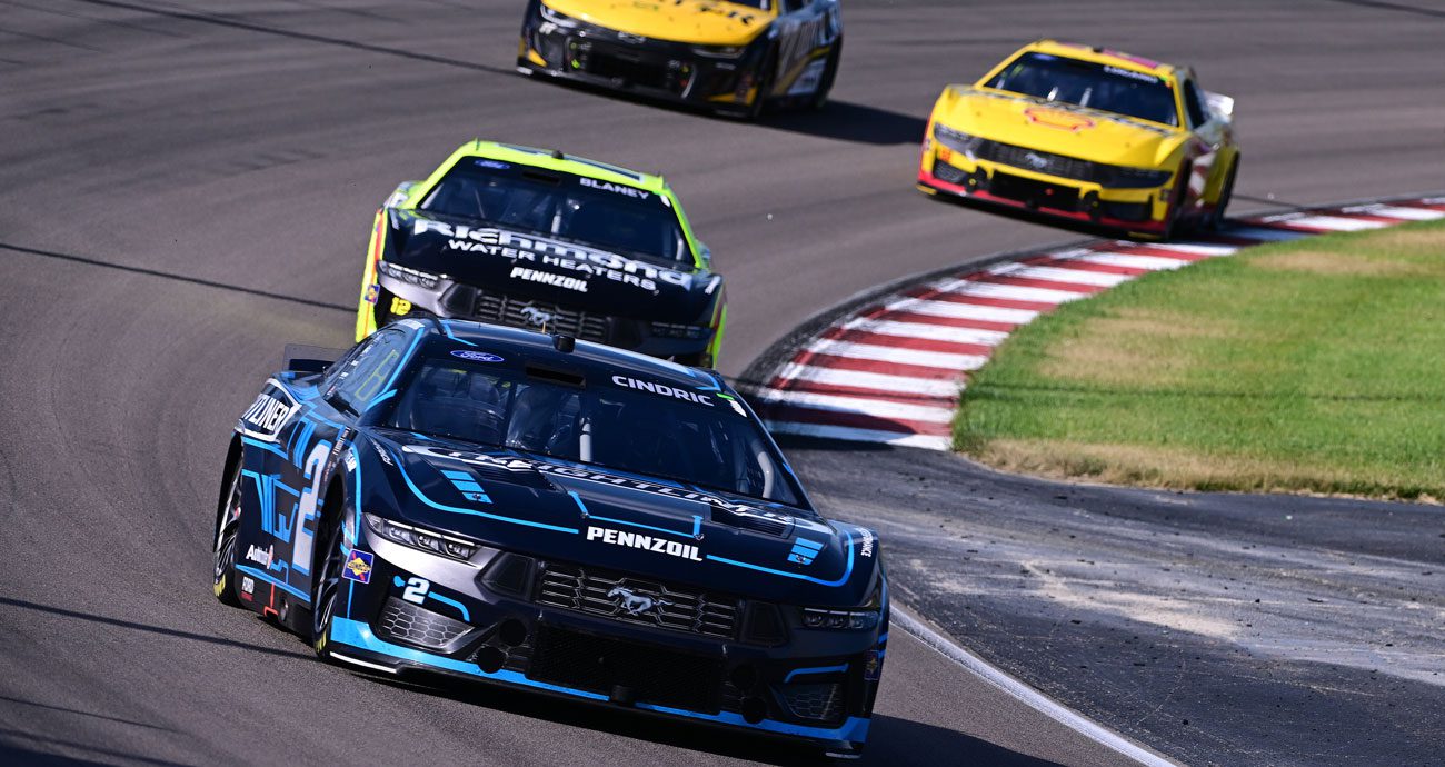 Austin Cindric, in the No. 2 Team Penske Ford, leads a group of NASCAR Cup Series cars at World Wide Technology Raceway at Gateway.