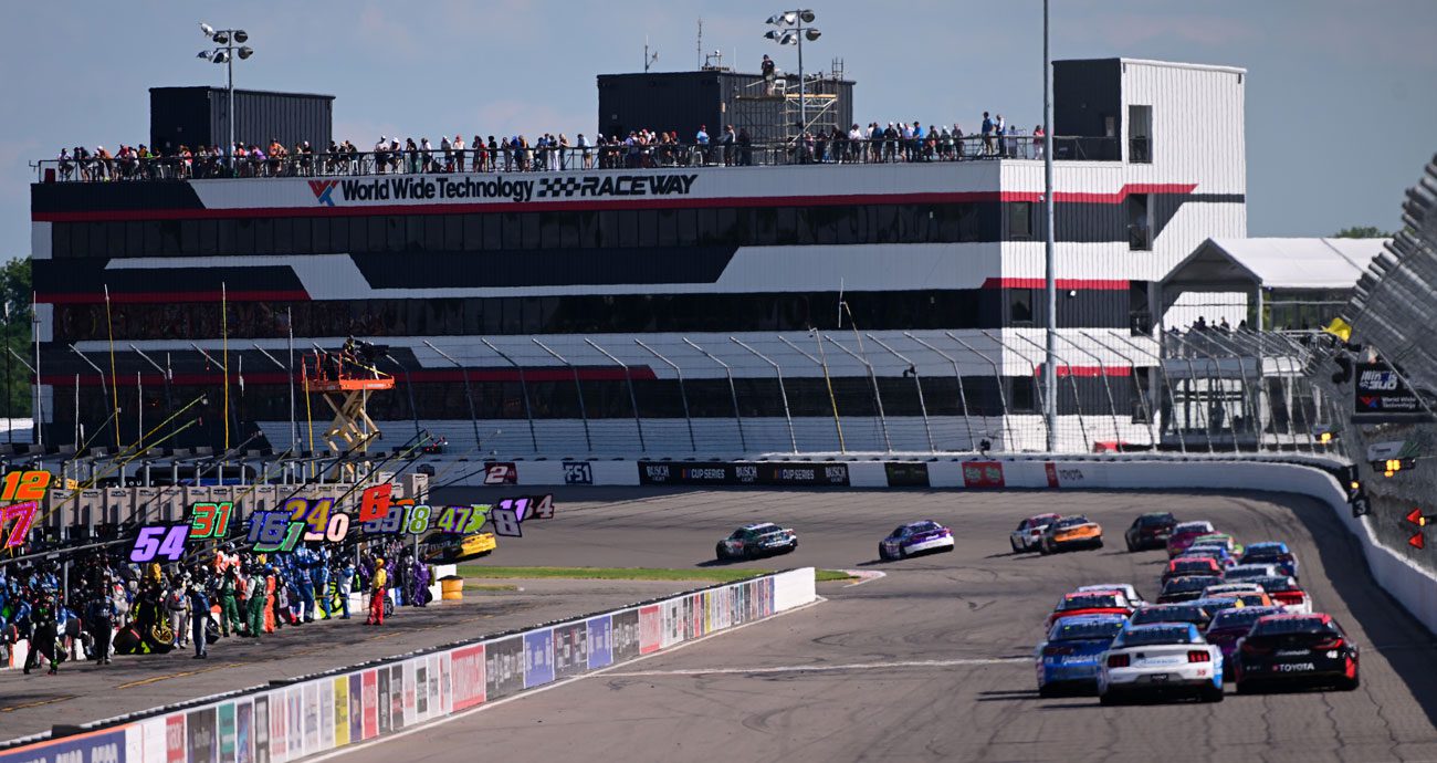 NASCAR Cup Series cars race through a turn at World Wide Technology Raceway at Gateway.