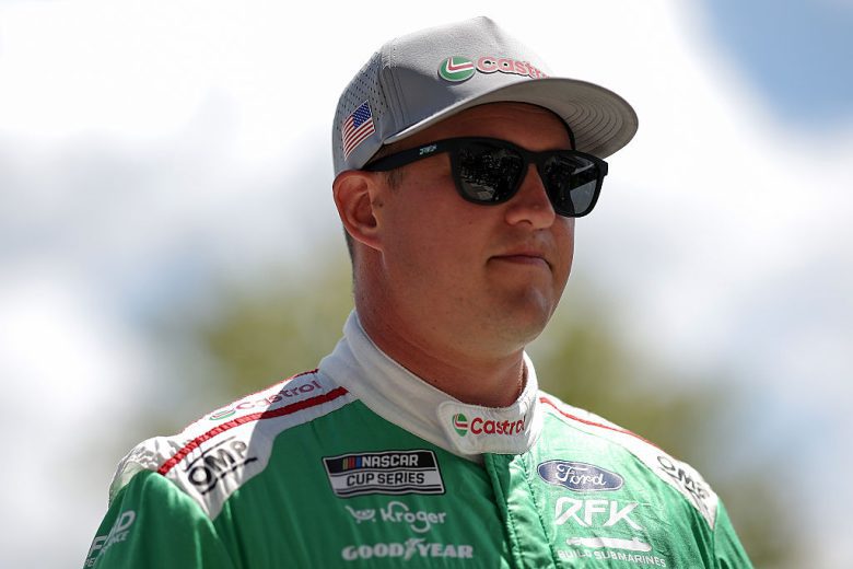Ryan Preece looks on.
