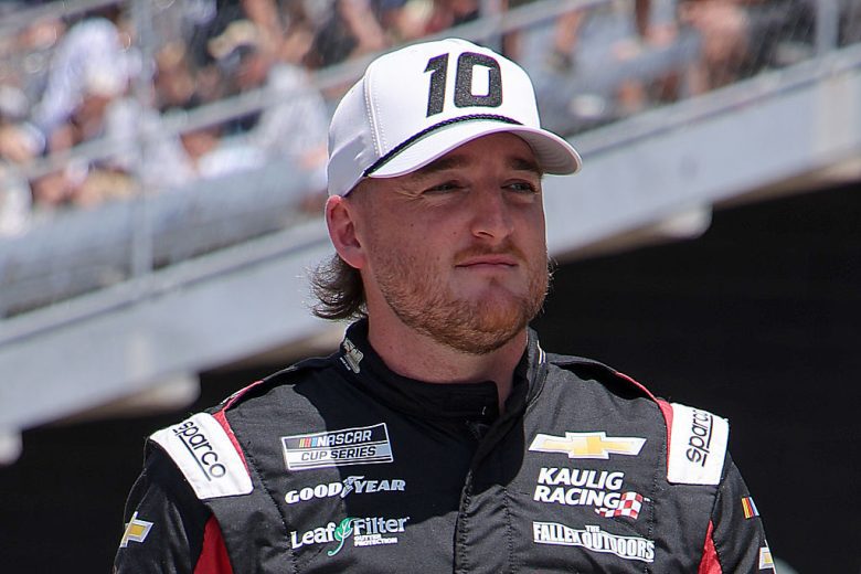 Ty Dillon looks on.