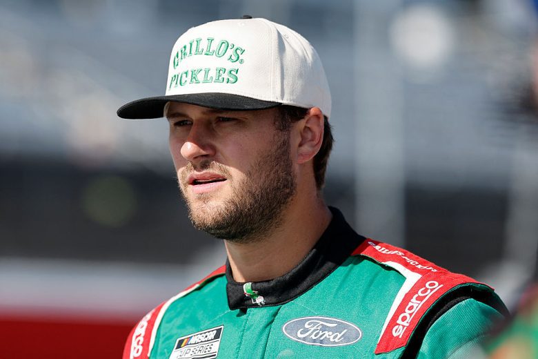 Todd Gilliland looks on.