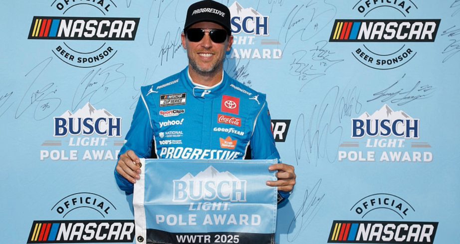 Denny Hamlin celebrates after winning the pole at Gateway.