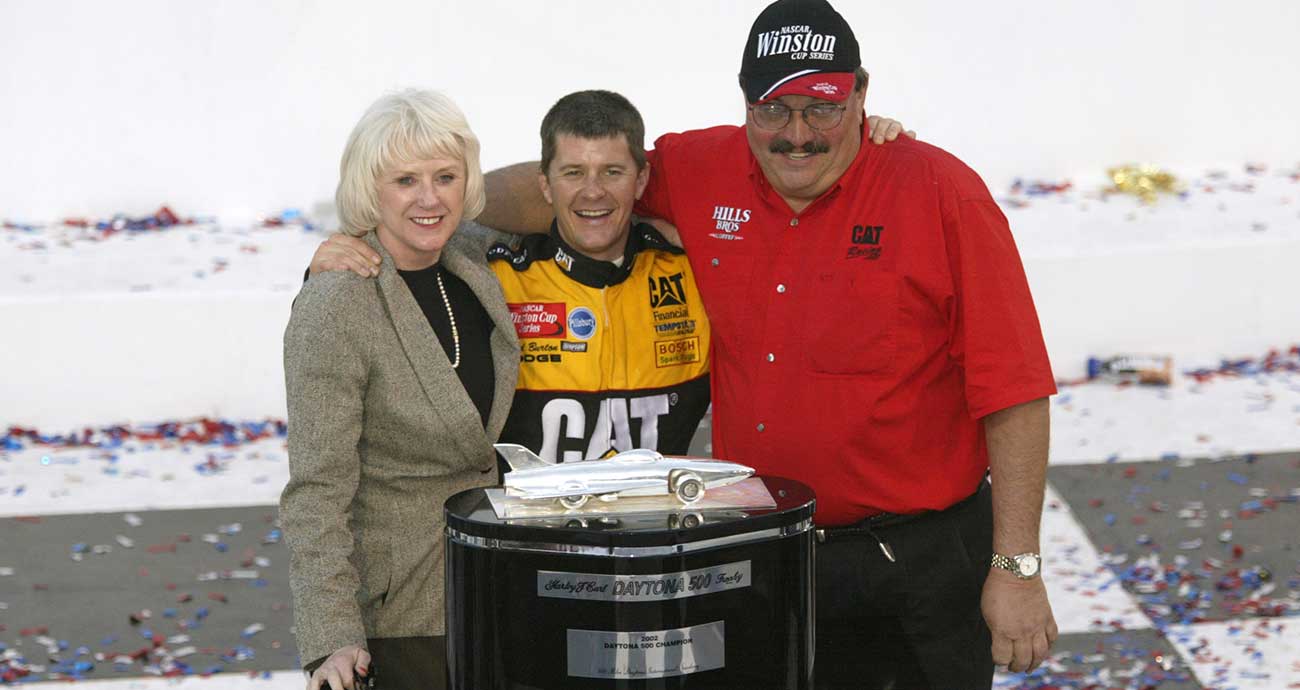 Bill and Gail Davis celebrate with Ward Burton at Daytona International Speedway in 2002