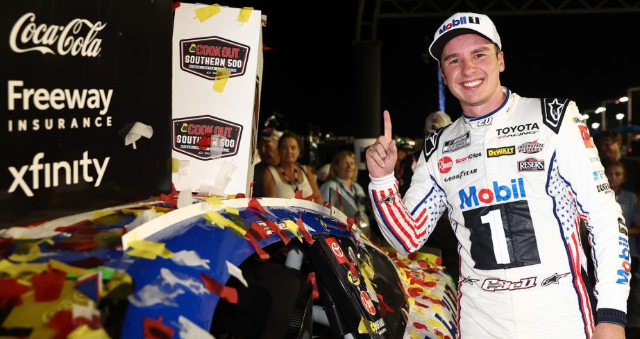 Christopher Bell stands by his car and flashes the No. 1 sign with his finger after winning the Cook Out Southern 500 on Sept. 6, 2026 at Darlington Raceway.