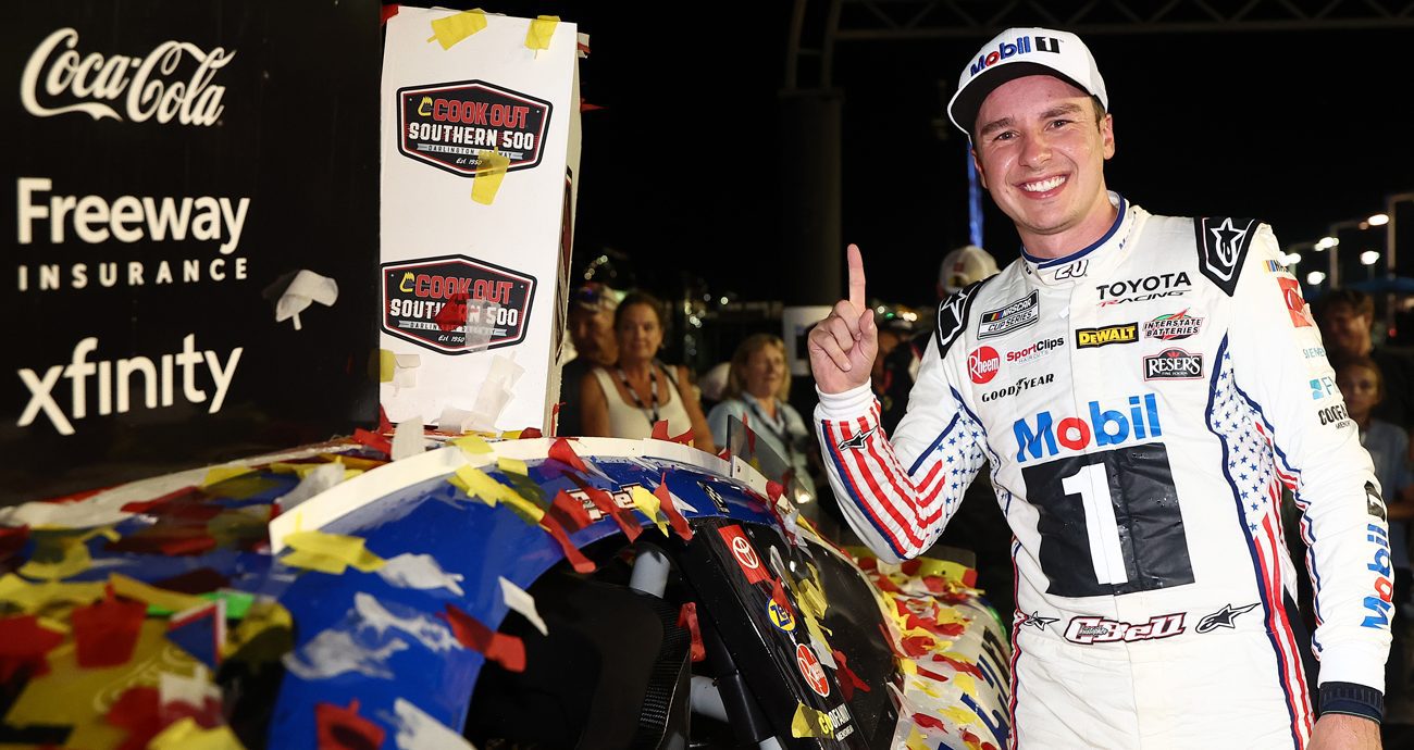 Christopher Bell stands by his car and flashes the No. 1 sign with his finger after winning the Cook Out Southern 500 on Sept. 6, 2026 at Darlington Raceway.