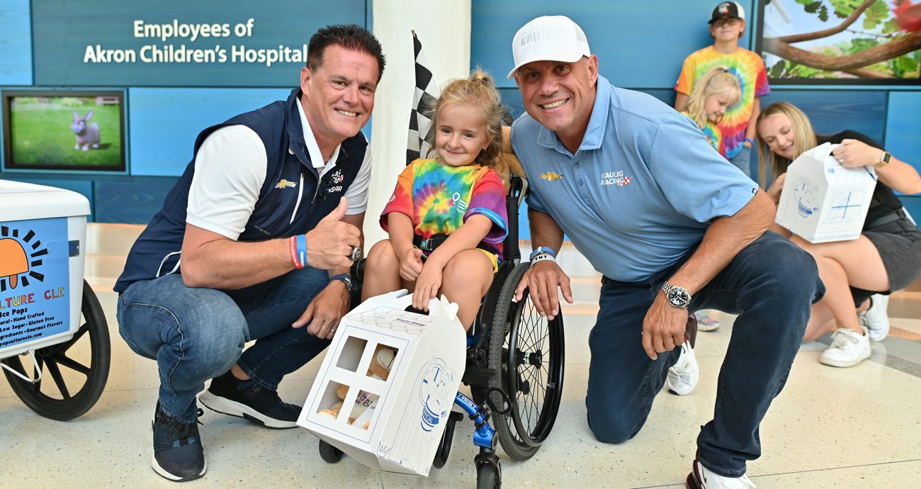 Matt Kaulig and Chris Rice with a patient at Akron Children's Hospital.