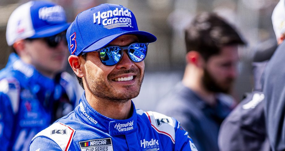 Kyle Larson looks on.
