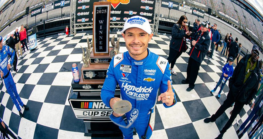 Kyle Larson holds up bristol sword.