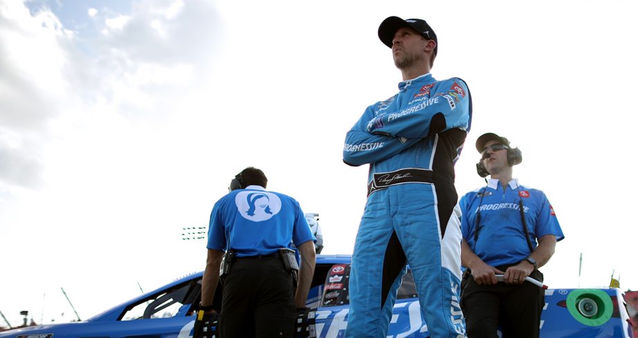 Denny Hamlin looks on.