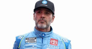 Jimmie Johnson, driver of the No. 84 Carvana Toyota, walks onstage during driver intros before the NASCAR Cup Series Coca-Cola 600 at Charlotte Motor Speedway on May 25, 2025 in Concord, North Carolina.