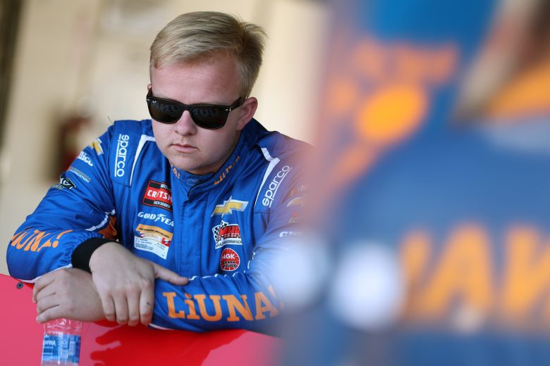 Tyler Ankrum looks on.