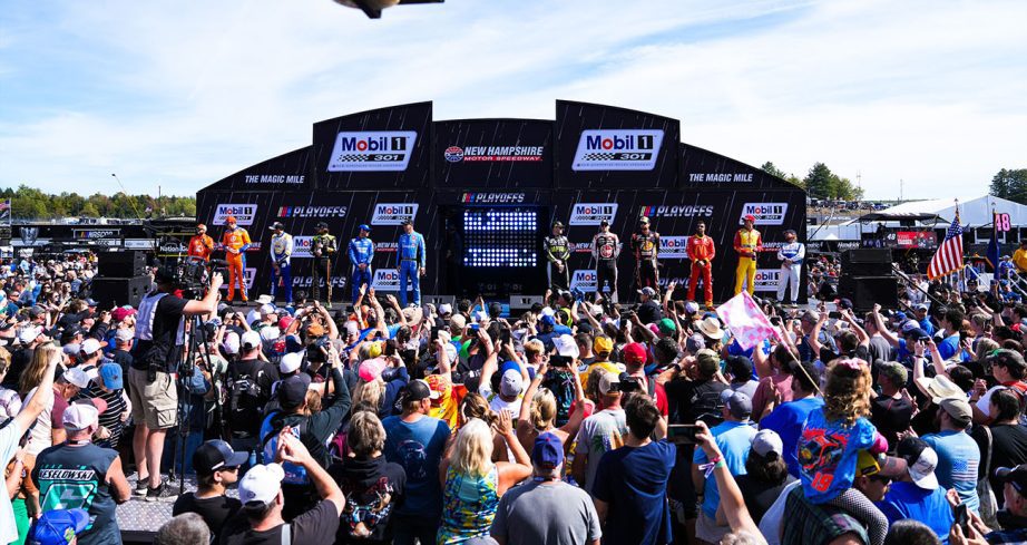 The audience cheers as NASCAR Cup Series Playoffs Round of 12 drivers stand on the stage at New Hampshire Motor Speedway.