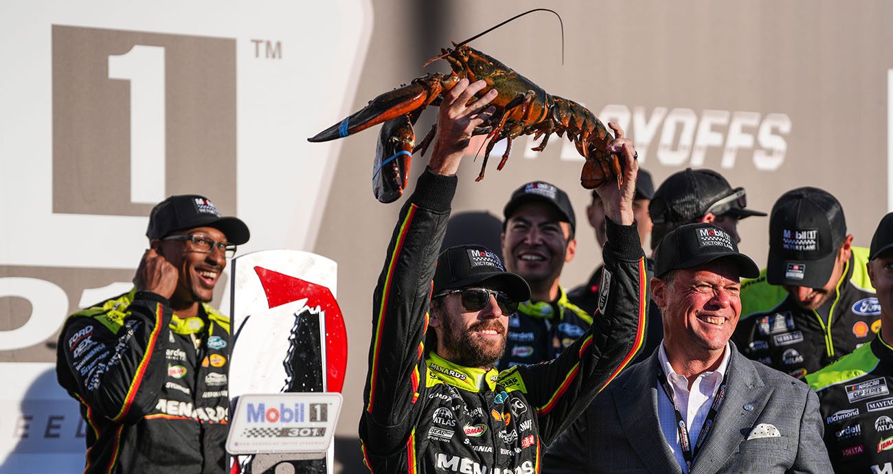 Ryan Blaney holds the victory Lobster following his NASCAR Cup Series win at New Hampshire Motor Speedway.
