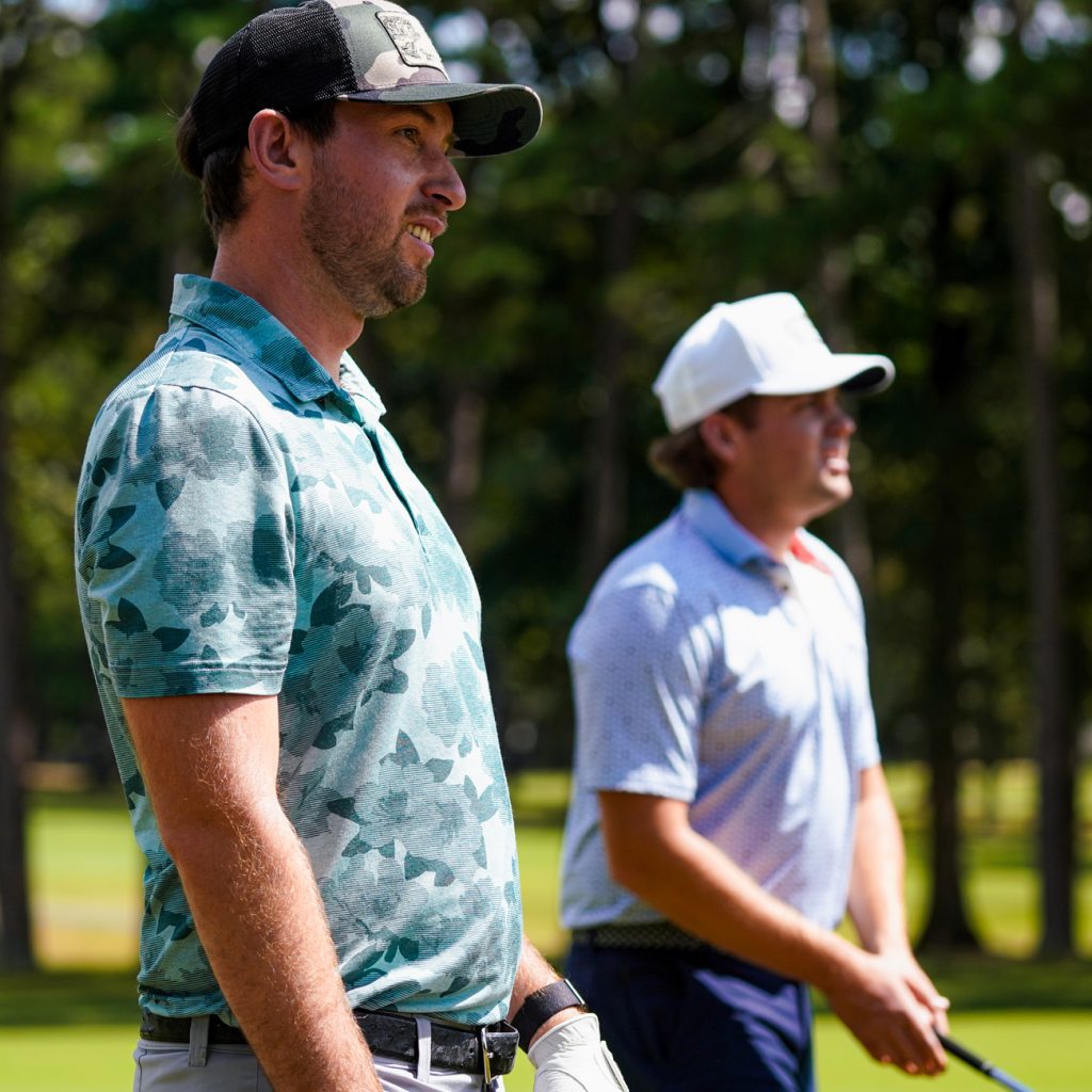 Chase Briscoe and Noah Gragson look on after Gragson hits at Rolling Hills Country Club in Monroe, North Carolina.