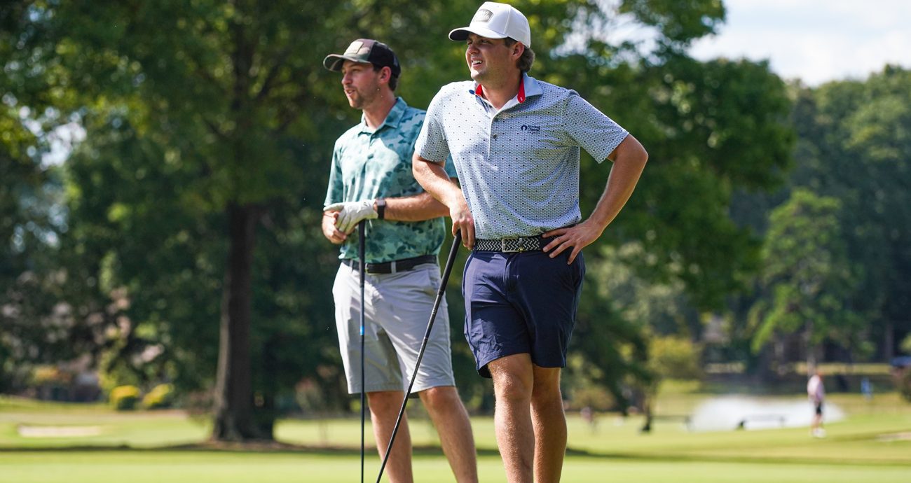 Chase Briscoe and Noah Gragson survey a hole at Rolling Hills Country Club in Monroe, North Carolina.