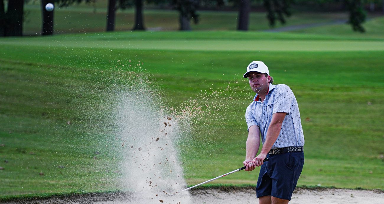 Noah Gragson blasts a shot from the bunker at Rolling Hills Country Club in Monroe, North Carolina.
