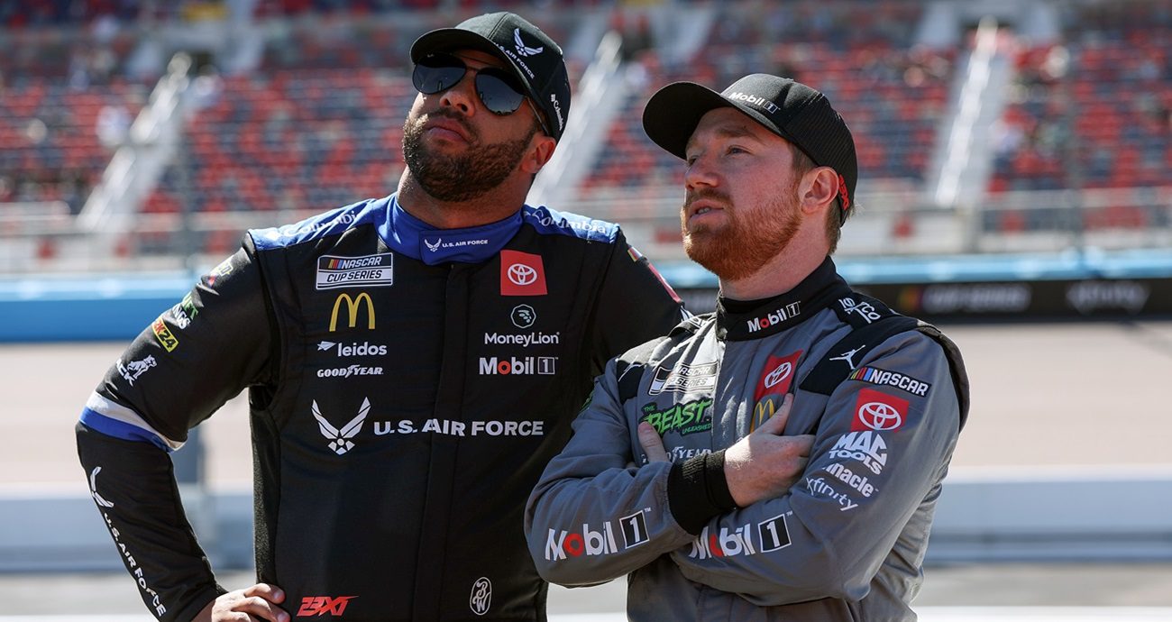 AVONDALE, ARIZONA - MARCH 09: Bubba Wallace, driver of the #23 U.S. Air Force Toyota, (L) and Tyler Reddick, driver of the #45 Mobil 1 Toyota, talk on the grid during qualifying for the NASCAR Cup Series Shriners Children's 500 at Phoenix Raceway on March 09, 2024 in Avondale, Arizona. (Photo by 