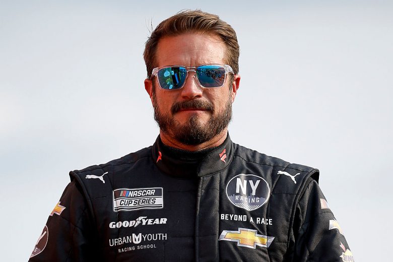 JJ Yeley looks on.