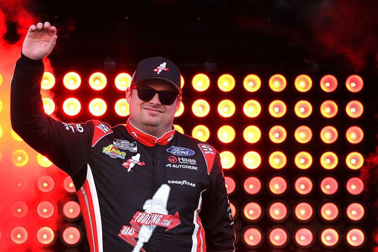 Cole Custer waves to fans.