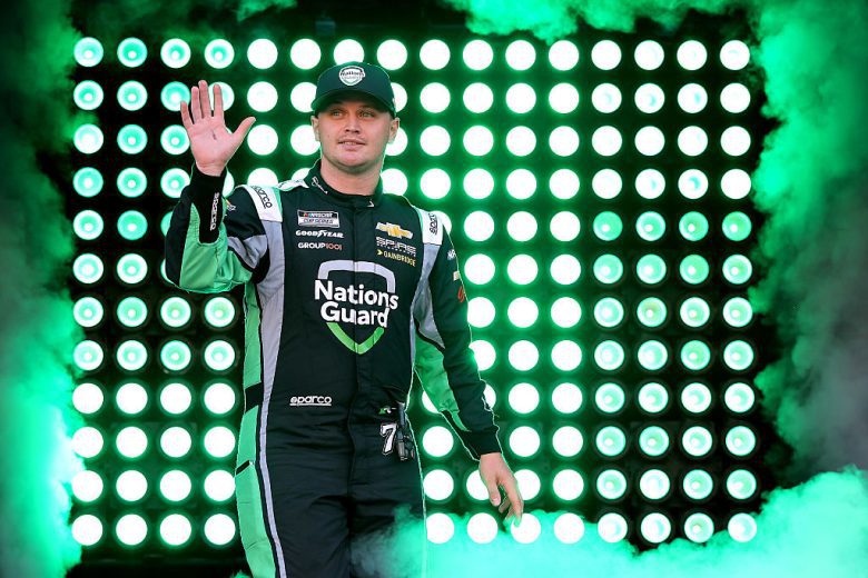 Justin Haley waves to fans.