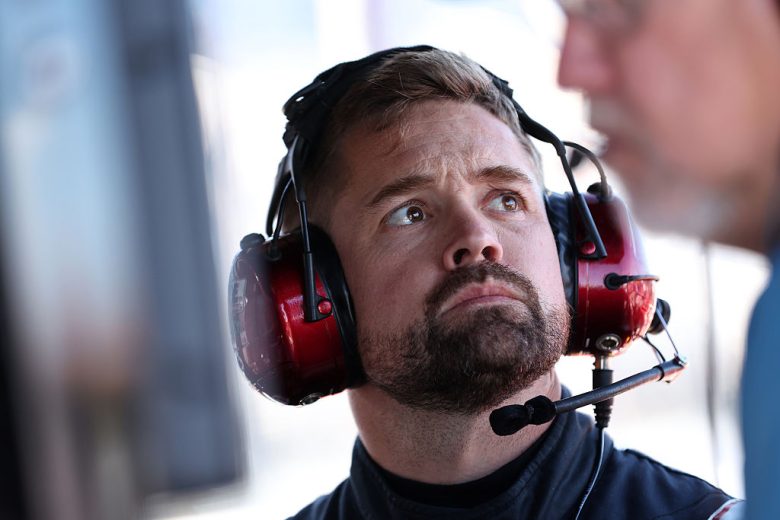 Ricky Stenhouse Jr. looks on.