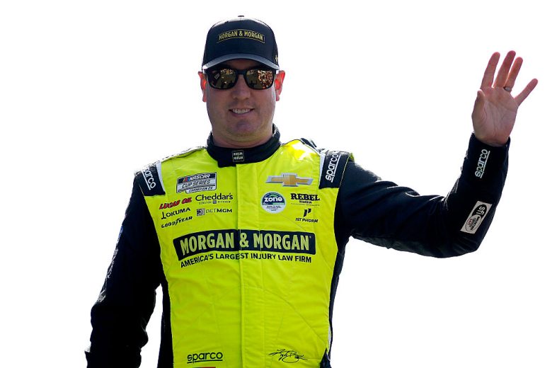 Kyle Busch waves to fans.