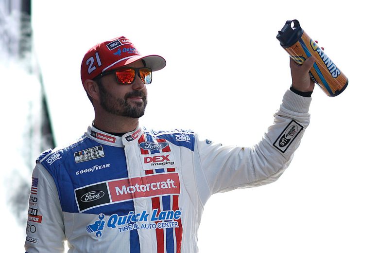 Josh Berry waves to fans.