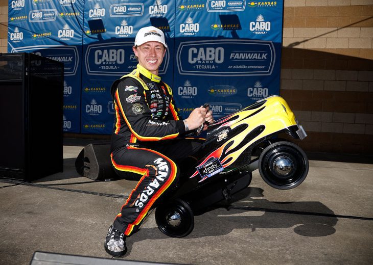 Brandon Jones celebrates after winning the pole at Kansas.