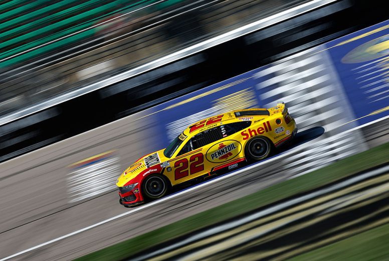 Joey Logano drives at Kansas.