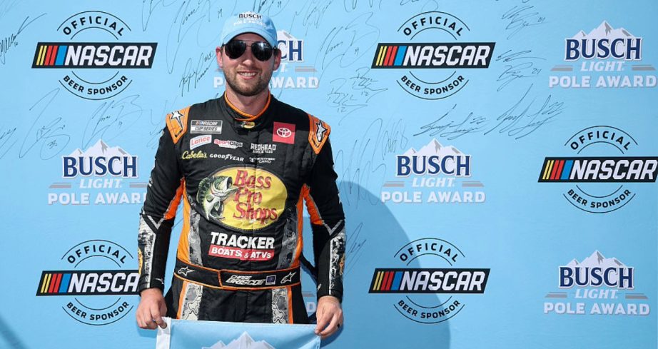 Chase Briscoe celebrates after winning the pole at Kansas.