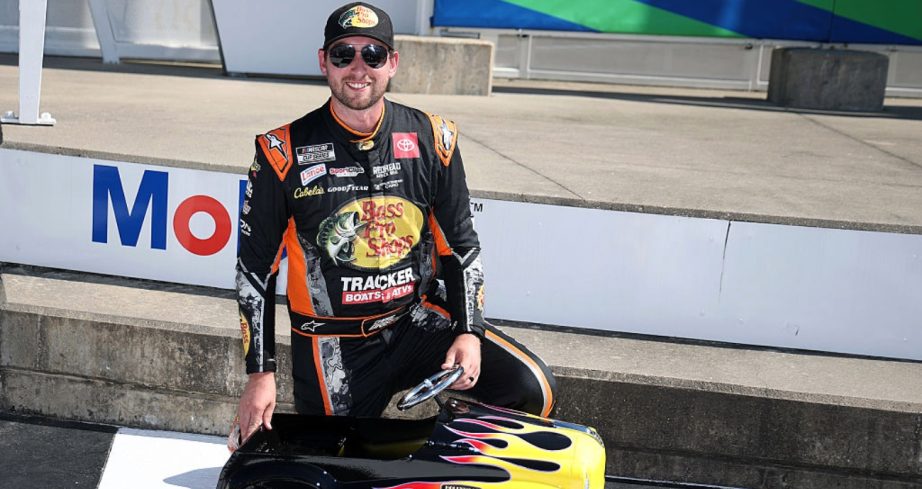 Chase Briscoe celebrates after winning the pole at Kansas.
