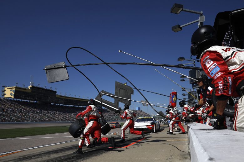 Denny Hamlin makes a pit stop at Kansas.