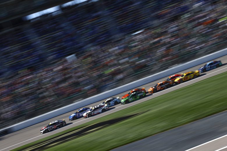 Christopher Bell leads an angry pack of cars at Kansas.