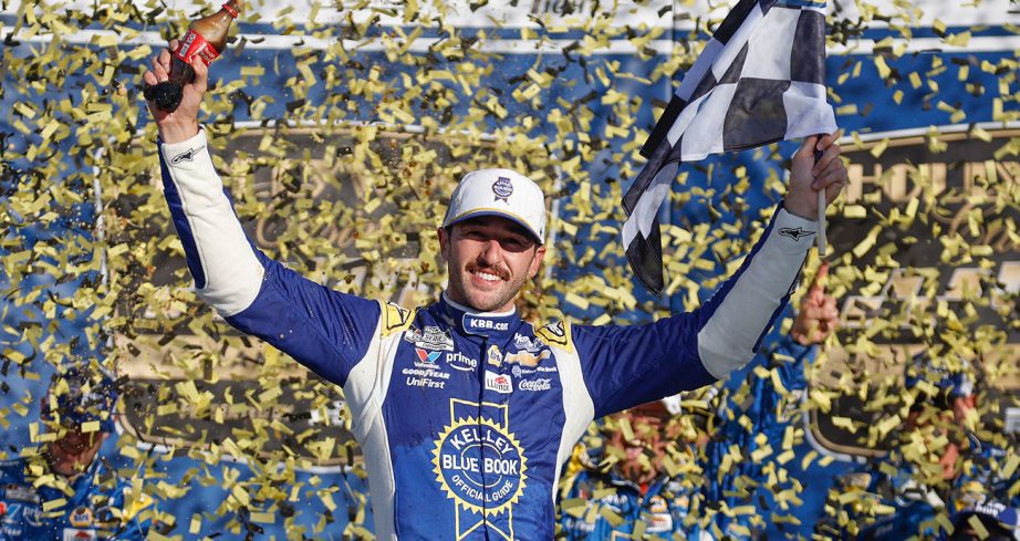 Chase Elliott celebrates in Victory Lane at Kansas Speedway following his NASCAR Cup Series win.