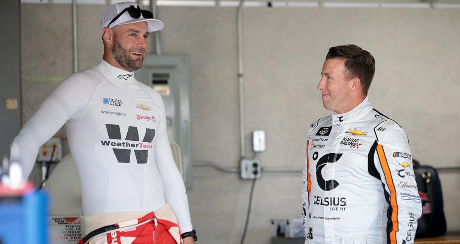 Shane van Gisbergen and AJ Allmendinger look on.
