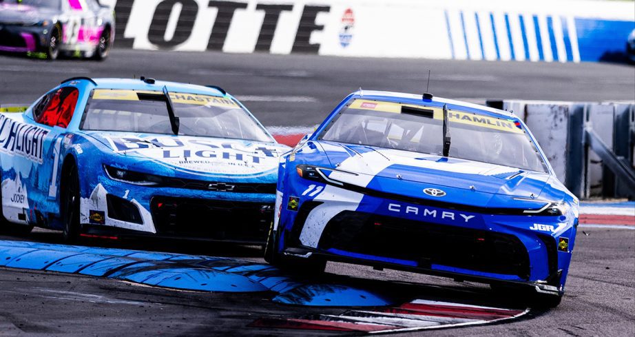 Denny Hamlin drives ahead of Ross Chastain.