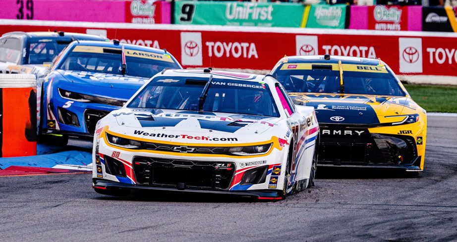 Shane van Gisbergen battles with Christopher Bell and Kyle Larson.