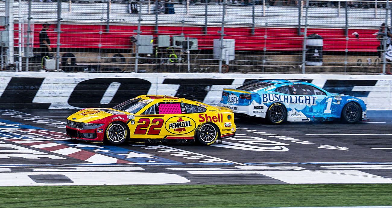 logano and chastain at the finish line