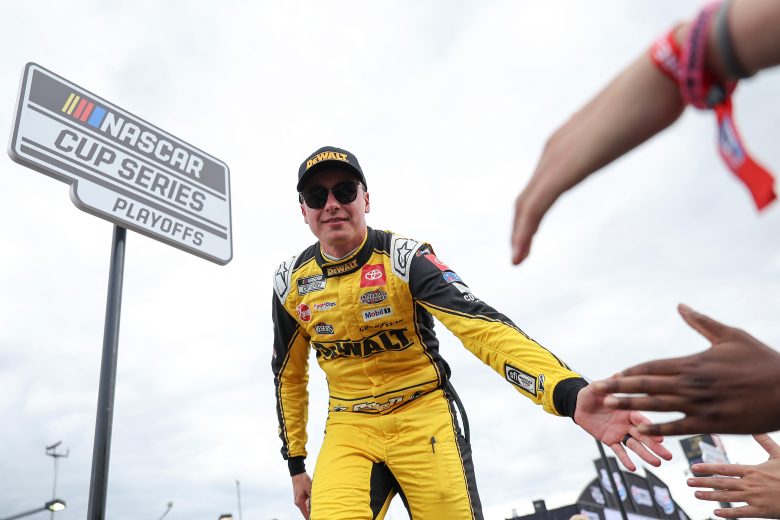 Christopher Bell gives high fives.