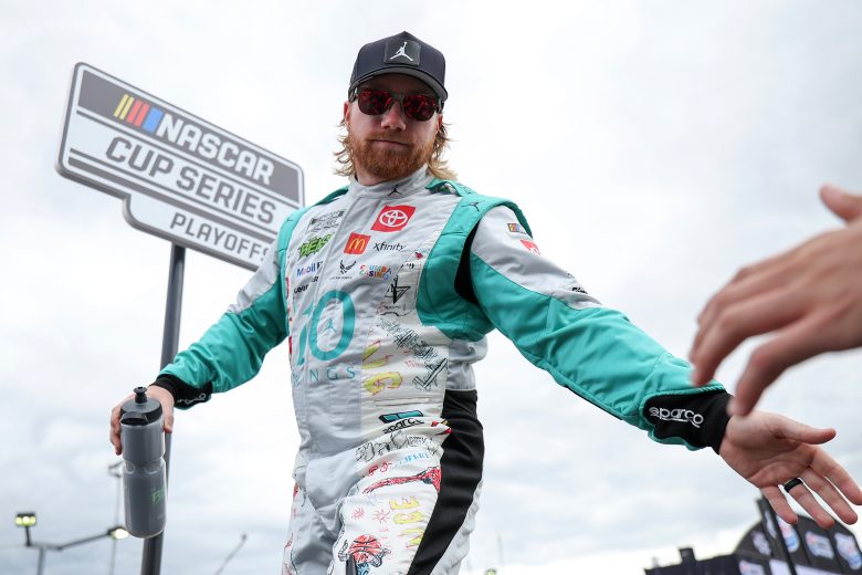 Tyler Reddick gives high fives.