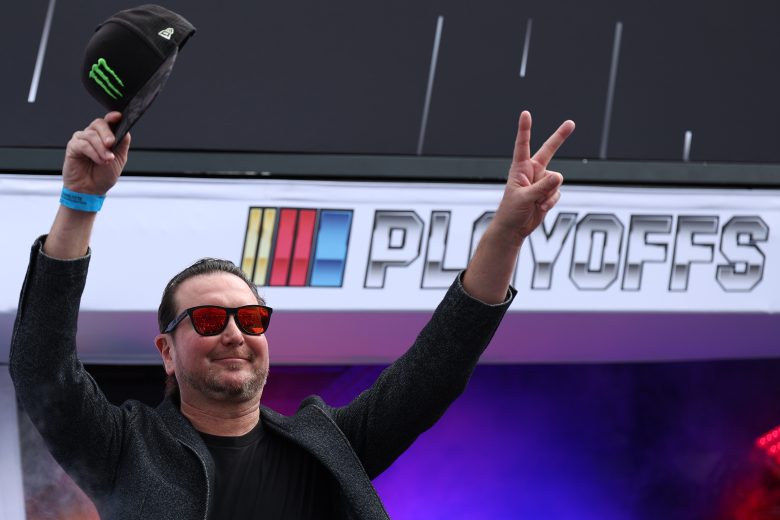 Kurt Busch waves to fans.
