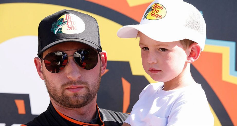 Chase Briscoe and Brooks Briscoe look on.