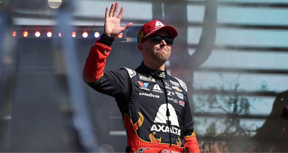 William Byron waves to fans.