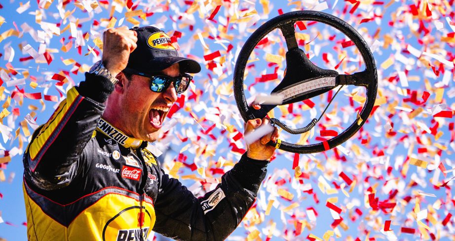 Joey Logano celebrates in Victory Lane.