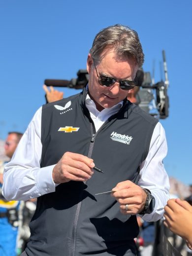 Jeff Gordon signs an autograph.